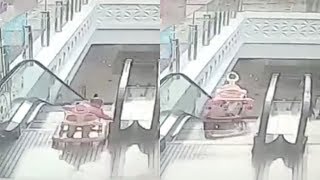 Heart-stopping moment after toddler falls on escalator