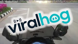 Motorcyclist Has Close Call with Red Light Running Semi || ViralHog