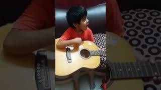 First try of hridan in guitar on bengali song...age 4.10yrs