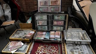 Iran's currency plummets to record low as Trump restores sanctions