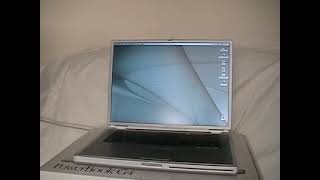 Apple Titanium PowerBook: demonstrating the slot-loading DVD drive