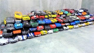 Lots of various miniature sports car models welly, kinsmart and more cars