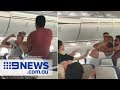 The moment a brawl breaks out mid-flight | Nine News Australia