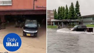 Drivers struggle through flooded roads in Kyushu after storms