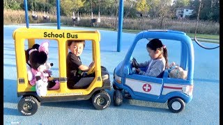 Riding School Bus and Ambulance Ride On Cars at the Playground