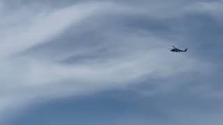 Coast guard helicopter patrolling shoreline in Florida