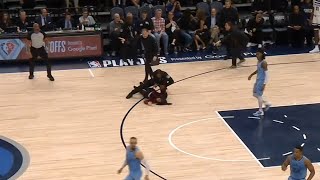 Fan runs on court and gets tackled by security during Grizzlies vs Timberwolves