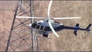 P.G. & E. cleans transmission towers by helicopter