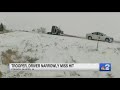 Close call: Truck sliding on ice nearly strikes two on the side of the road