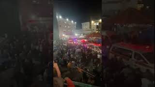 Crowds gather outside of hospital after Israeli attack
