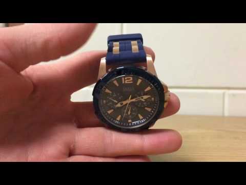 Set date, time and day on a guess watch Set date, time and day on a guess watch