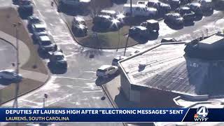 Sky 4 over Laurens High after "electronic messages" sent