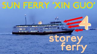 (SHIP) Sun Ferry four-storey ferry 'XIN GUO' with old company First Ferry livery on Victoria Harbour