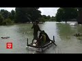 heavy rains flood gorakhpur people use boats after road turns into river