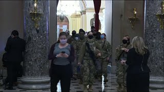 Armed National Guard arrive at the Capitol