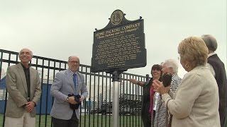 Historical marker dedicated to Home Packing Company explosion from 1963