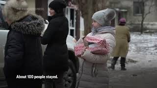 Defiant Ukrainian residents hide from daily shelling