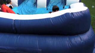 Moonwalkrentalswoodlands.com - 32ft Slip and Slide inflatable moonwalk
