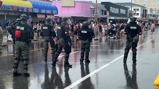 Police in tactical gear clear Ocean Boulevard in Hampton, New Hampshire, after fights break out