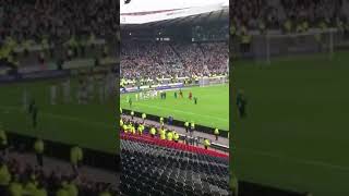 Celtic fans celebrating winning against Rangers in the Scottish Cup Semi Final Hampden Park