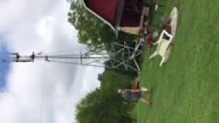 Raising an 8’ Aermotor windmill on a 40 foot tower with a tractor.