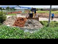 Amazing bulldozer cleaning soil, trash, trees and pushing filling land powerfully