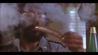 Tommy Chong takes a hit off his pipe