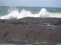 nasty surfing wipeout close to rocks