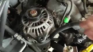 How to remove the alternator out of the engine bay 2001 2002 2003 Mazda Protege