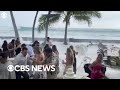 Big wave crashes wedding reception in Hawaii