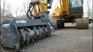 Excavator mulcher attachment quickly devours trees in road ditch (operator view)