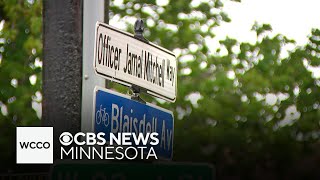 Friends, family and community gather to honor Officer Mitchell by naming a portion of a street after