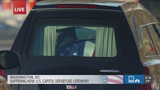 Jimmy Carter's motorcade heads through Washington D.C. to national funeral site