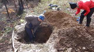 Digging a soil pit on a disturbed forest site