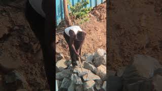 Worker breaking stones with hammer #workers #work #breaking #stone #hammer #construction #building