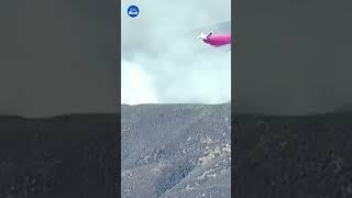 Planes drop fire retardant over Hughes Fire