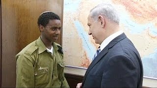 Israeli Prime Minister Benjamin Netanyahu meets with Ethiopian Israeli soldier Damas Pakada