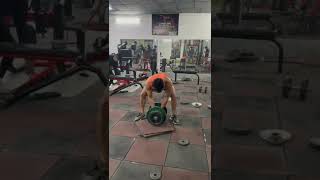 Strongman practice session single dumbbell press