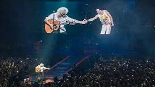 Brian May Cries while shaking hands with Imaginary Freddie in concert
