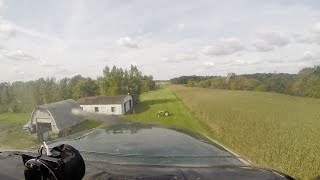 Challenging Grass-Runway Landing Over A Tractor