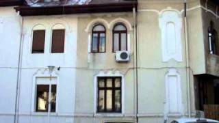 Identical Neo-Romanian style houses in Bucharest square