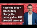 How long does it take to fully charge the battery of an ADT doorbell camera?