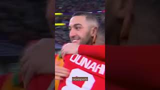MOROCCAN PLAYERS CELEBRATE AFTER WINNING WORLD CUP GAME AGAINST PORTUGAL