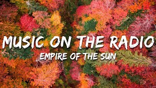 Empire Of The Sun - Music On The Radio (Lyrics)