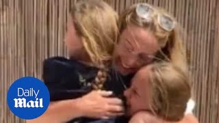 Heart warming moment mum reunites with daughters after nine weeks