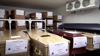 Inside a British funeral home grappling with COVID