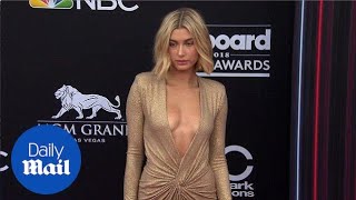 Hailey Baldwin glitters in plunging gold gown at Billboards - Daily Mail