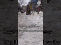 toronto toronto cleaning up piles of snow along sidewalks