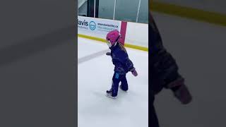 Hanna is learning to ice skate on her pink Balance Blades