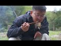 man cooking solo in outdoor shanyeji food grilled fish with lemongrass and yunnan dai spices